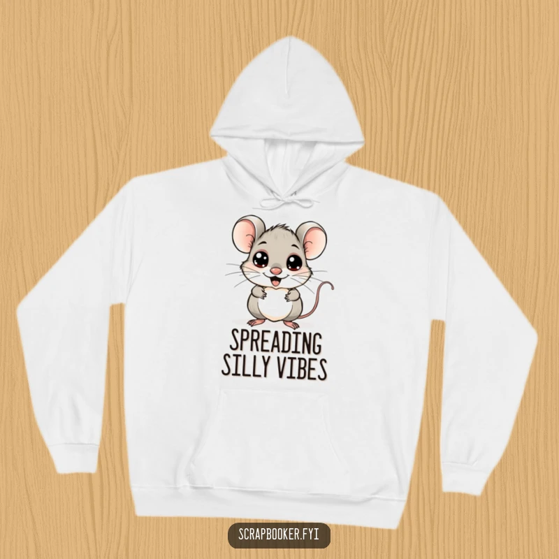 Funny mouse hoodie, cheerfully sticking googly eyes onto a whimsical drawing, providing cozy artistic amusement.