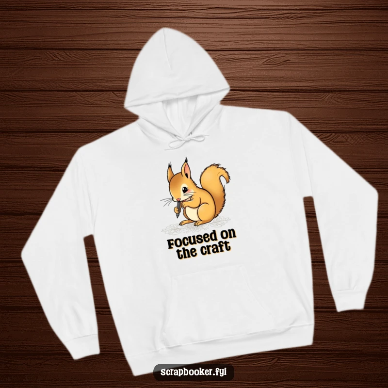 Funny hoodie featuring a focused squirrel artist meticulously drawing intricate patterns with a fine-tip pen, highlighting dedication and artistic skill.