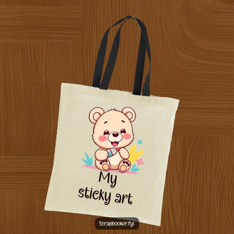 Funny tote bag showcasing a happy bear cub with a glue stick and a paper craft, perfect for art supplies.